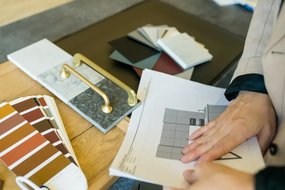 Woman choosing details of a new kitchen for interior remodeling