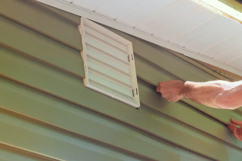 Wall facade of new house is covered with vinyl plastic siding panels installed by Dagmar Pros