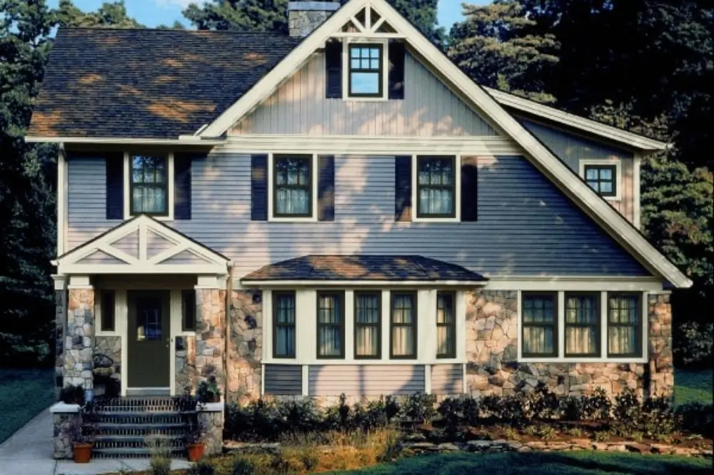 A two-story house with many Simonton windows facing the viewer. Dagmar Construction uses Simonton windows in custom window installation services