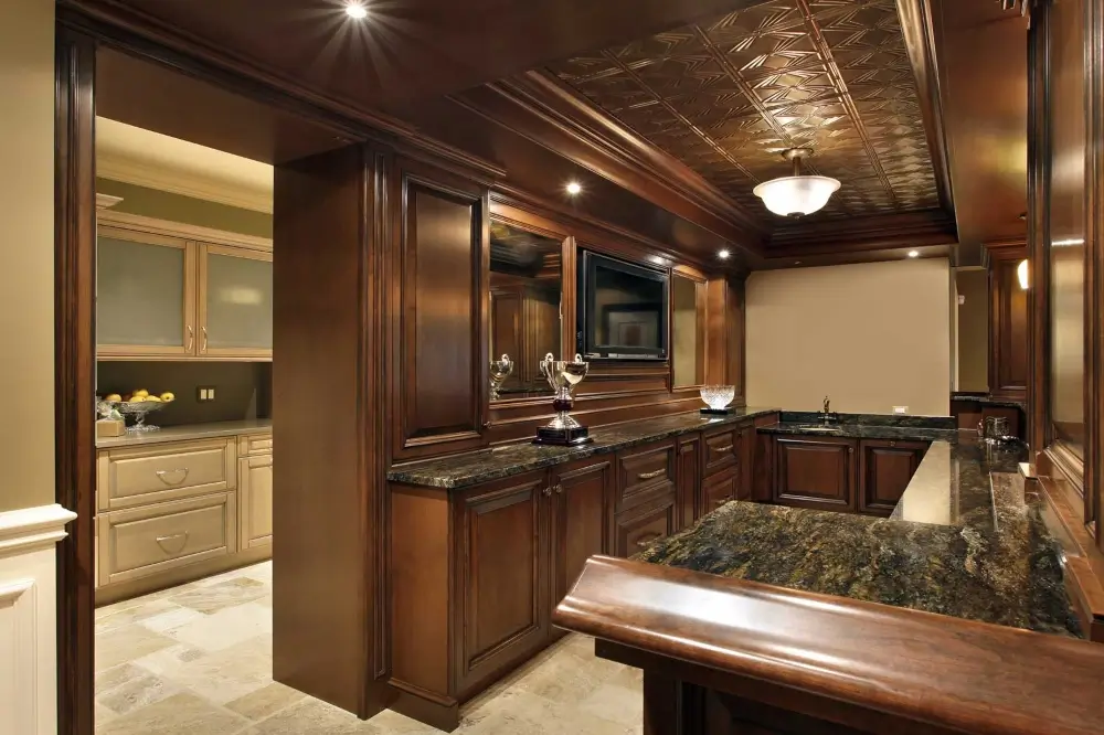 Wood trophy room in a basement with marble countertops, after basement remodeling