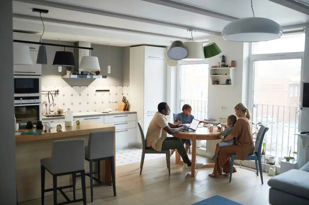 closeup of a family in a dining area, in a newly remodeled kitchen and dinging room - Dagmar Construction