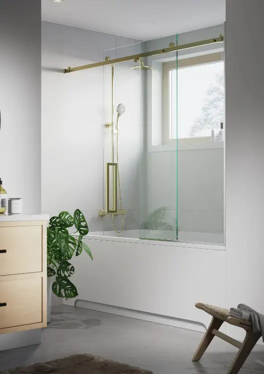 White marble bathroom with a new shower, bathtub, and toilet, after bathroom remodeling